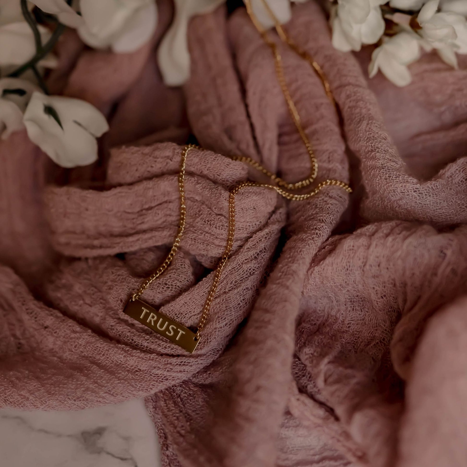 Detailed View of Gold-Plated Necklace with Trust Engraving